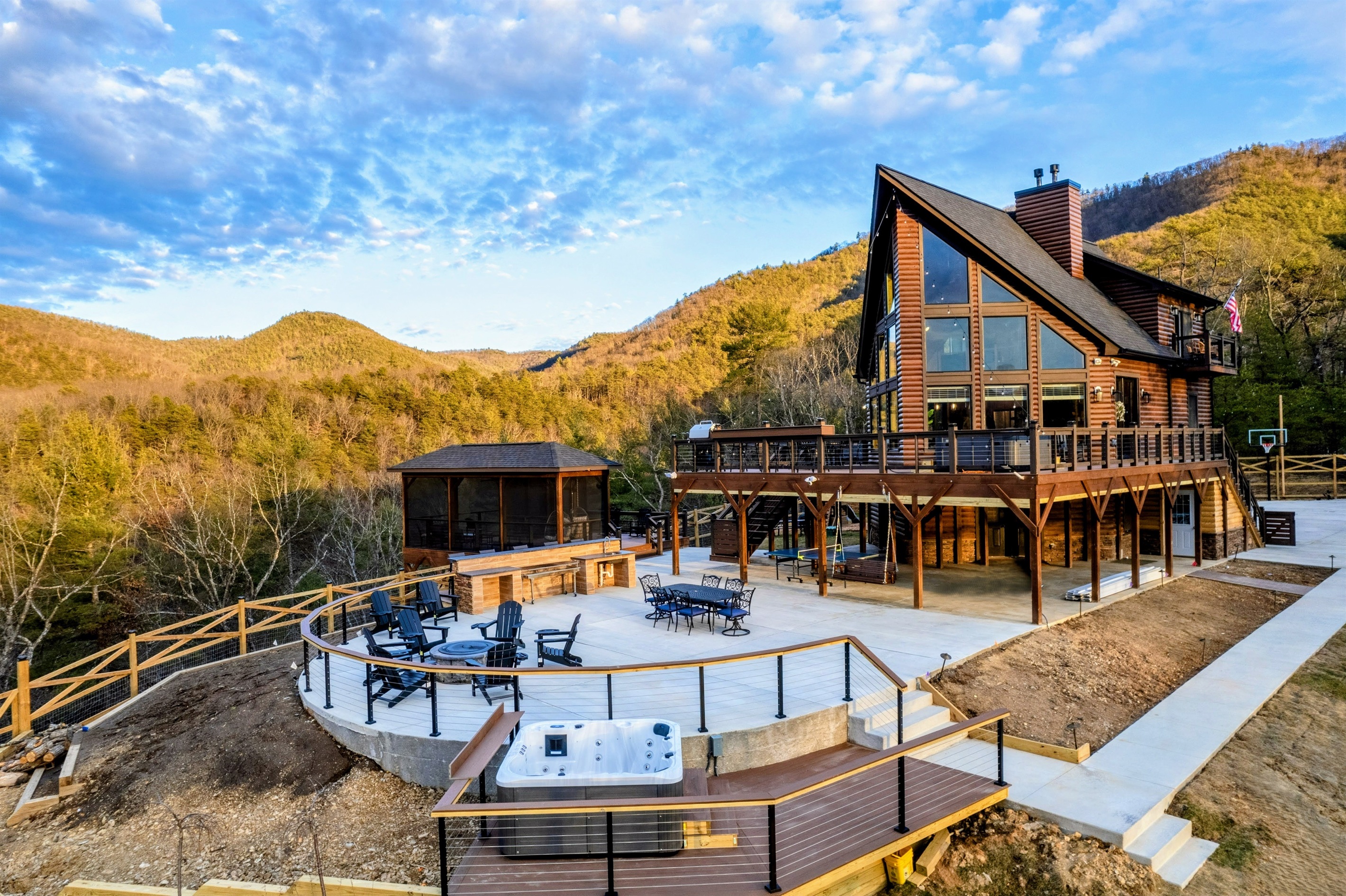 Mountain View Magic – Expansive decks, a private hot tub, and soaring A-frame windows create the perfect setting for stargazing, dining, and relaxing high above the Appalachian Mountains.