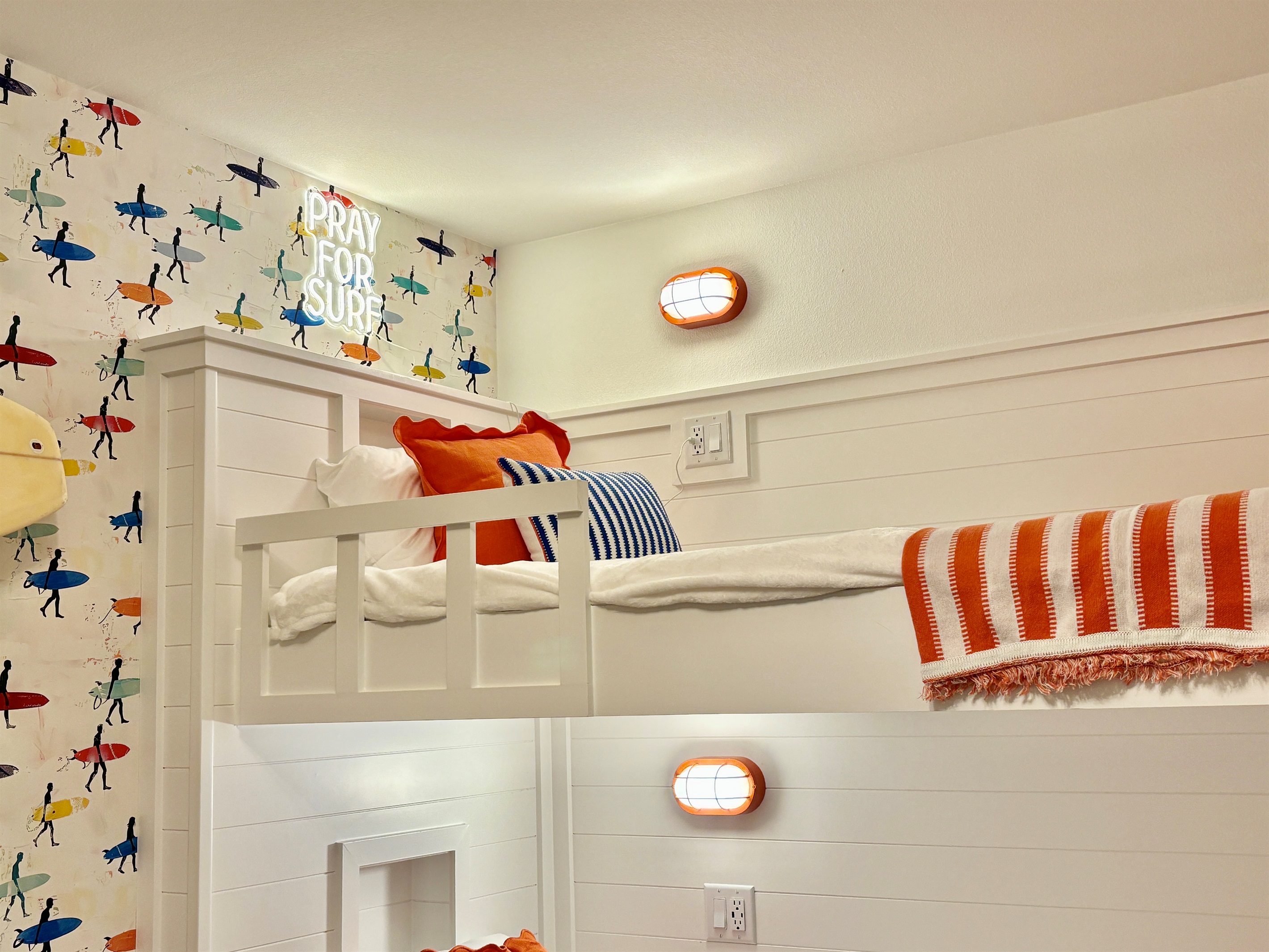 The Sunrise Surf Shop bunks provide charging stations, nooks and a personal reading light.