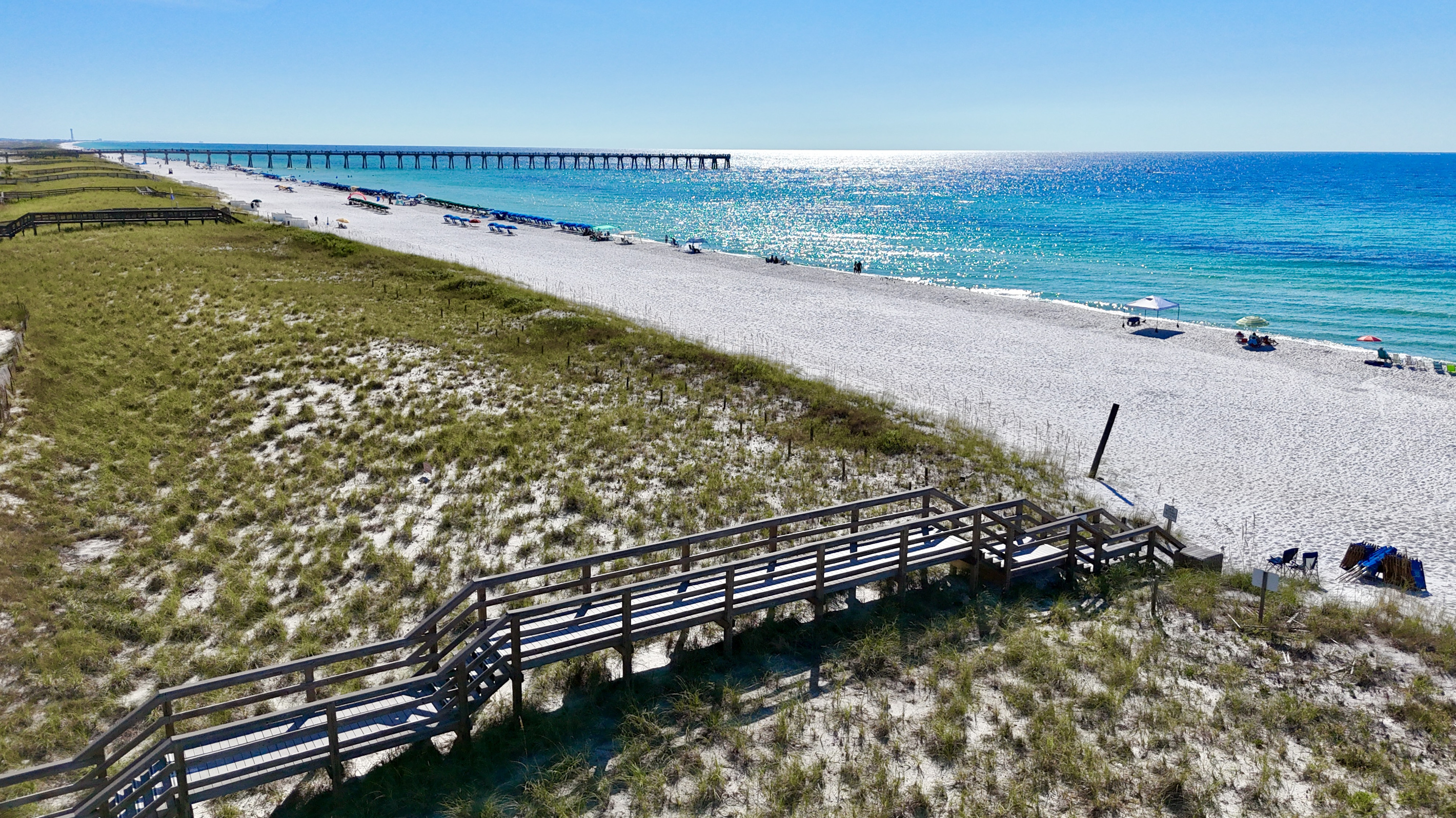 We have two private dune bridges available for our guests to access one of the quietest sections of Navarre Beach. Ninety seconds from our front door and your toes are in the sand!!