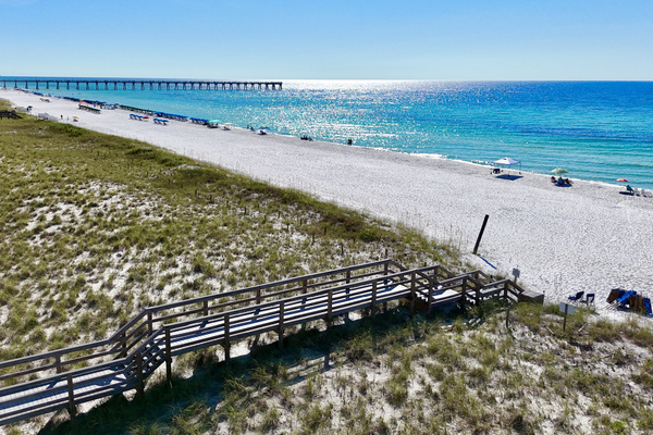 We have two private dune bridges available for our guests to access one of the quietest sections of Navarre Beach. Ninety seconds from our front door and your toes are in the sand!!