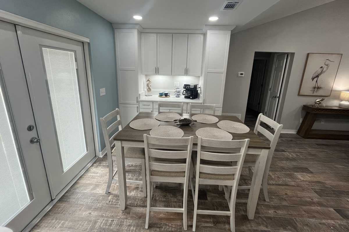 The high-top dining table seats 6.