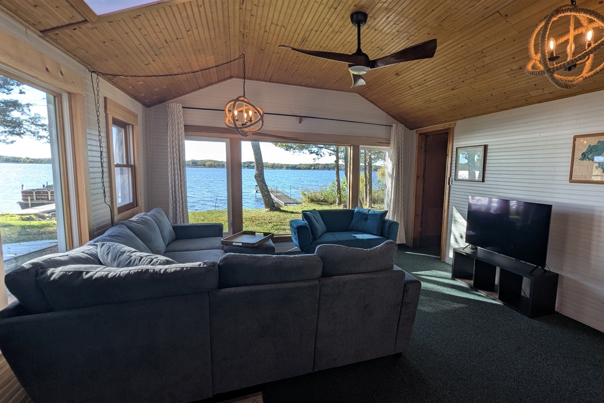 Living room with large lake view windows