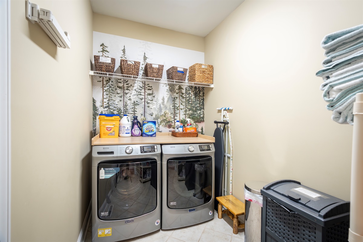 Full-size washer & dryer with forest mural, spa towels, and every laundry essential—detergents, softeners, stain removers, and more. Plus: extra supplies, first aid, sewing kit & hot tub towels ready to go