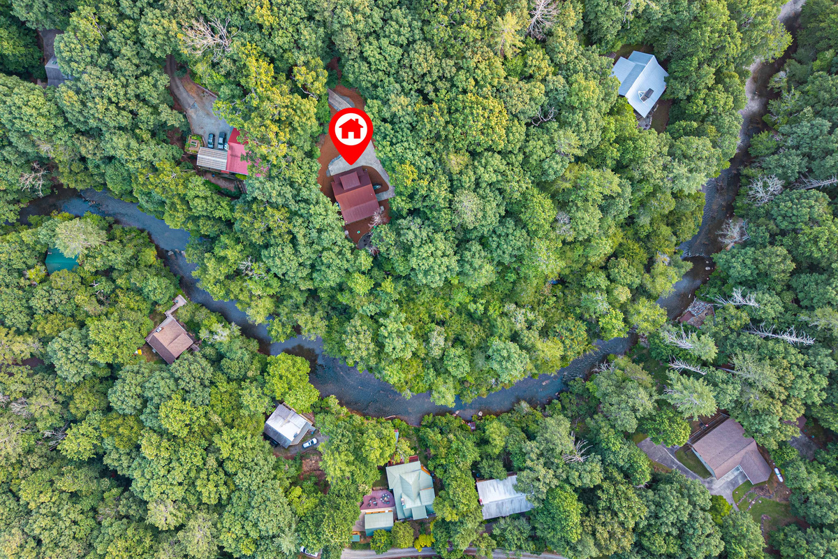 Nestled in the trees with river frontage and a private mountain setting.