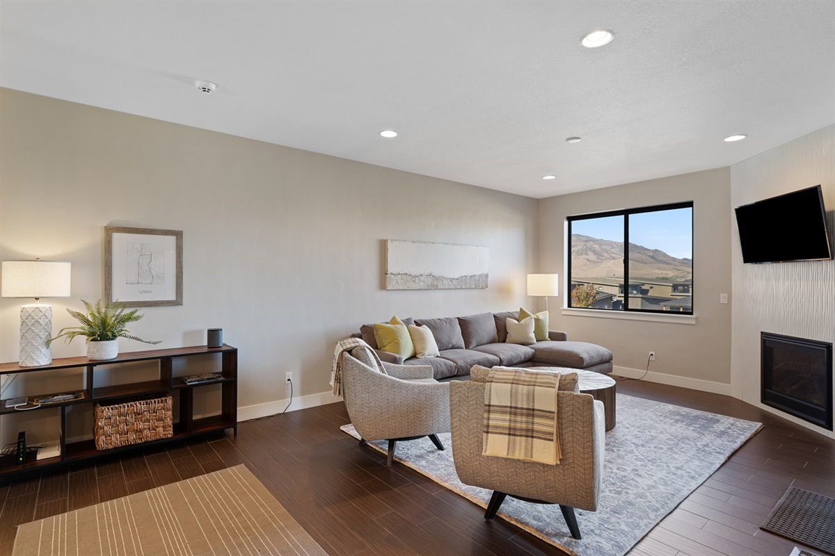 Inviting living room with comfortable seating and warm natural light.