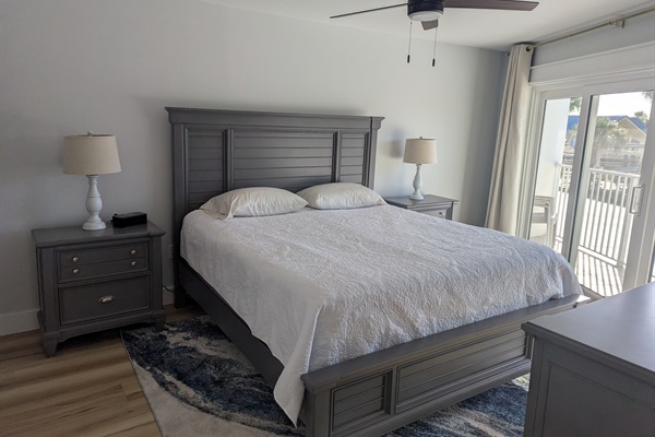Primary Bedroom with King Size Bed and Patio Access