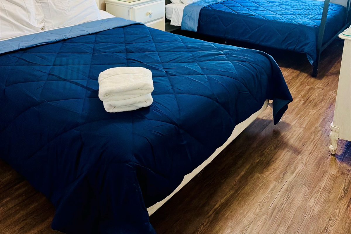 Upstairs kids bedroom with a Queen Bed + a bunk bed with a queen bed on bottom and full bed on top