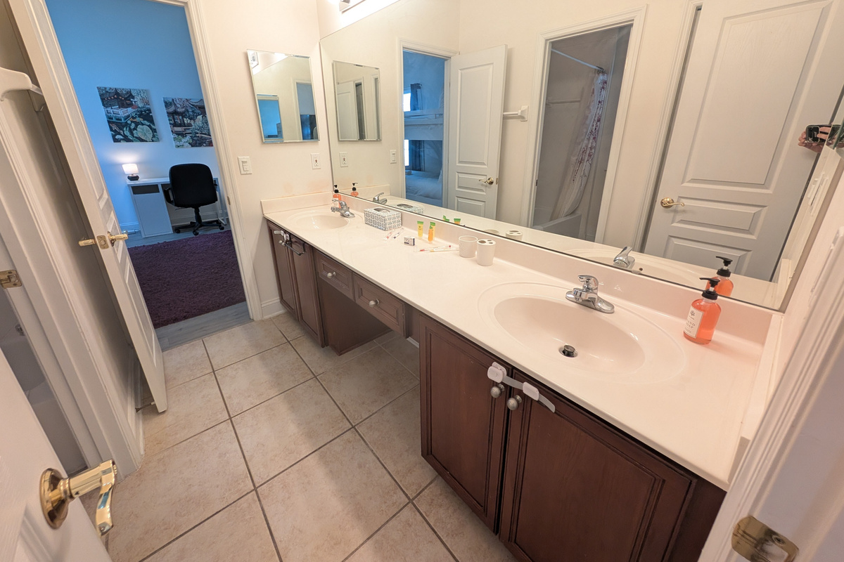Spacious bathroom vanity with dual sinks, giving guests plenty of room to get ready.