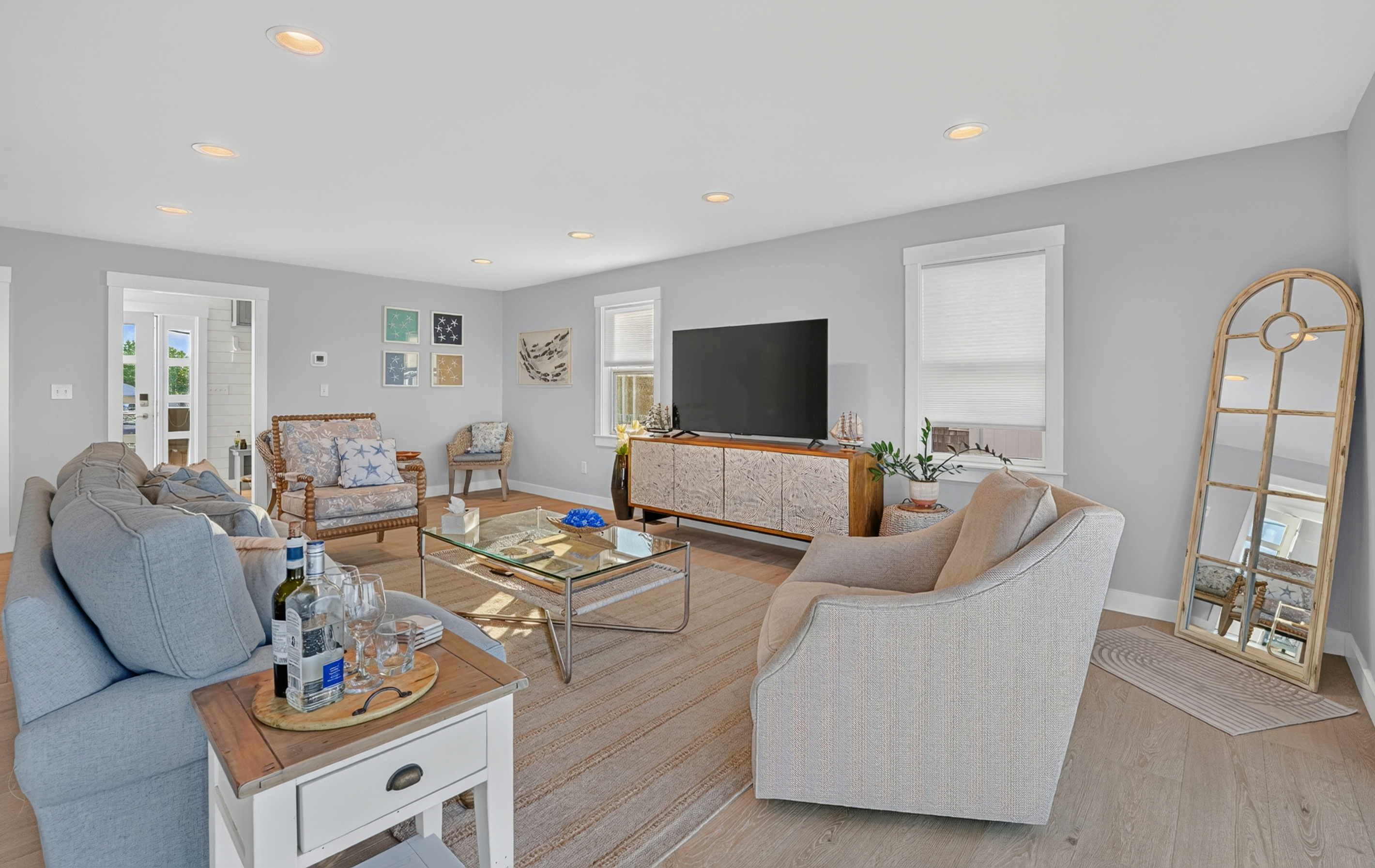Thoughtfully designed living space with comfortable furnishings and a bright coastal atmosphere
