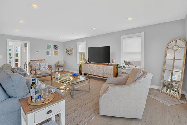 Thoughtfully designed living space with comfortable furnishings and a bright coastal atmosphere