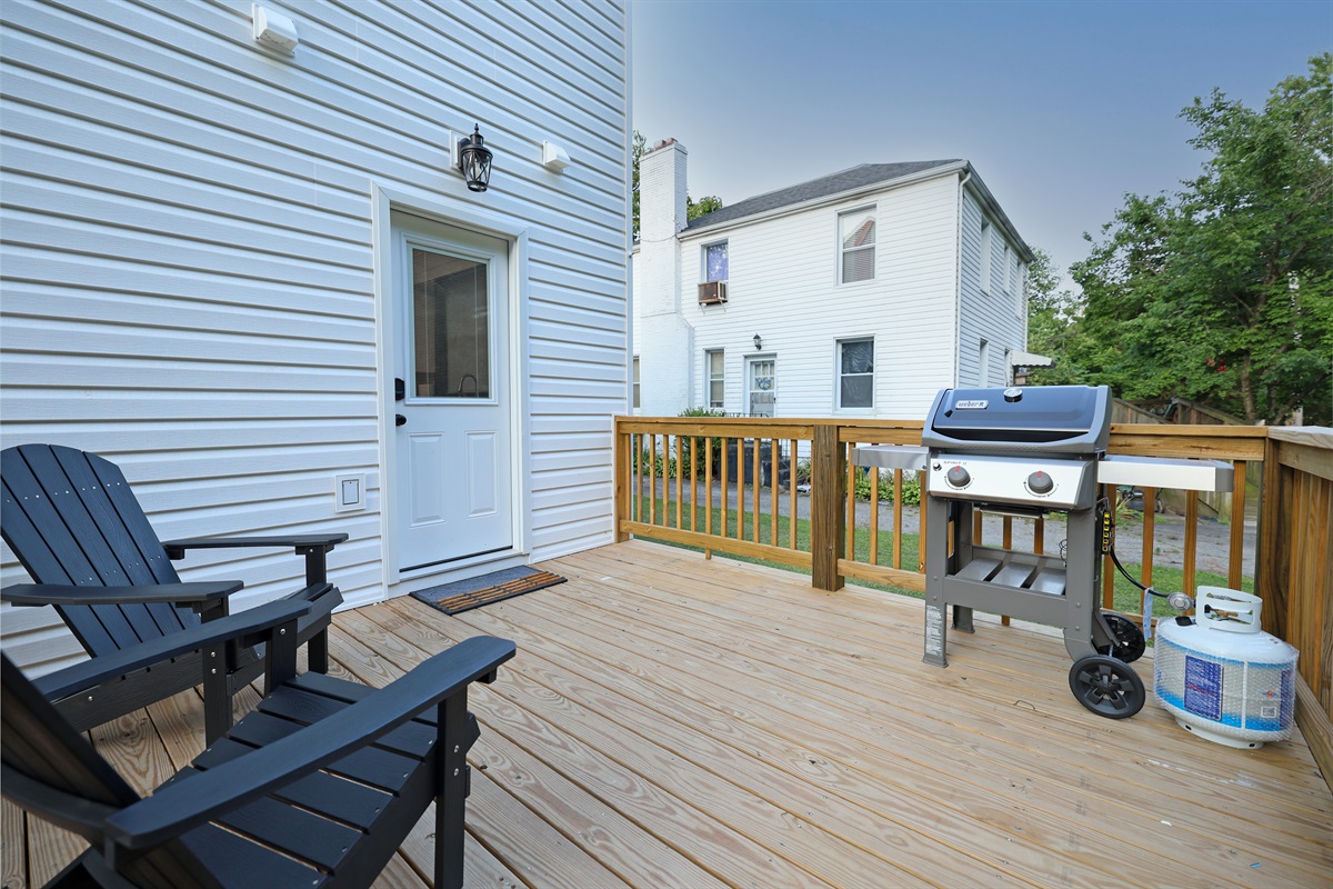 Back deck with seating an gas grill for barbecues