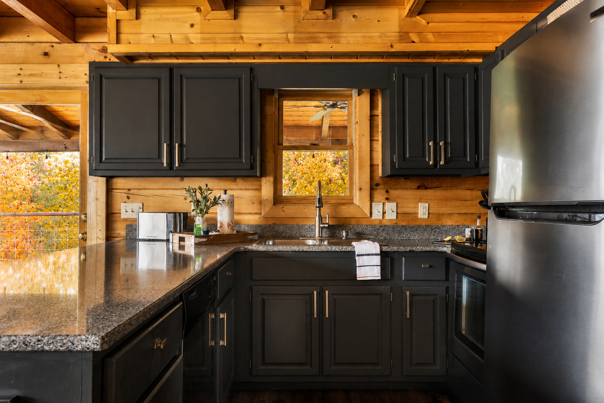 Our well-stocked kitchen has a granite countertop and seating for four