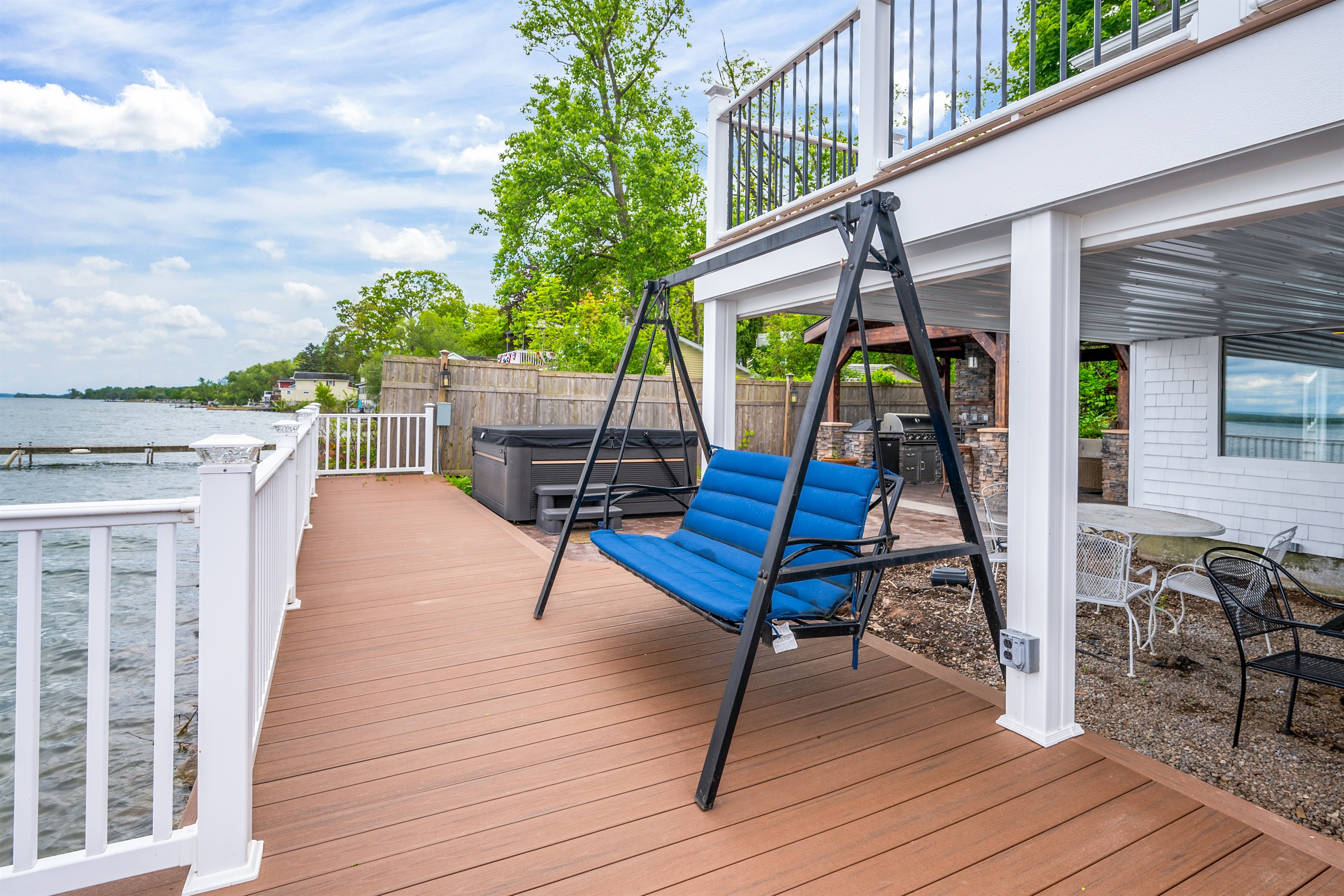 Lakeside swing and private hot tub make for unforgettable relaxation and fun moments.