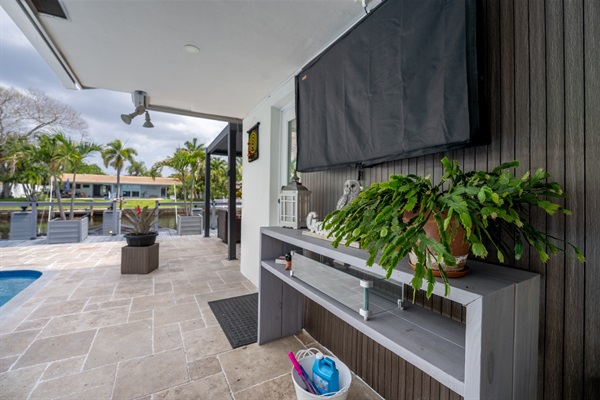 Luxury outdoor living space beside the heated pool
