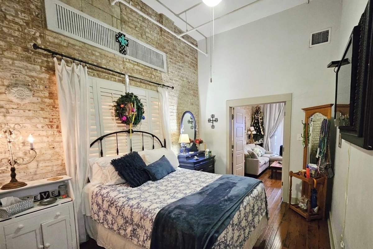 Queen bed, looking from laundry room - bathroom is on your right, behind you.