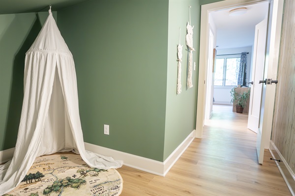 A secret, kid-size treehouse "hideaway" for the little ones to play and/or sleep; located upstairs, directly off the master suite. 