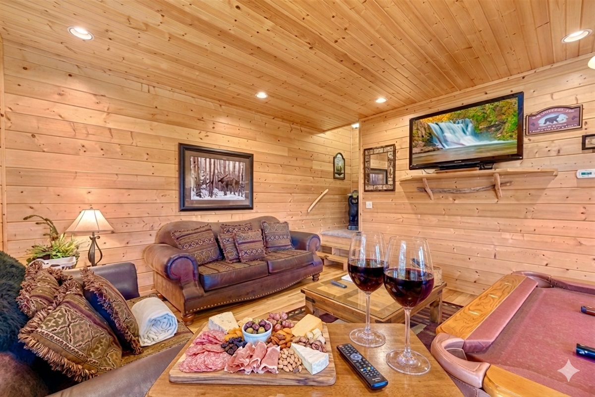 Kick back after a day of exploring! This comfy lounge is perfect for movie nights or friendly pool games, with soft lighting and rustic charm that make you feel right at home.