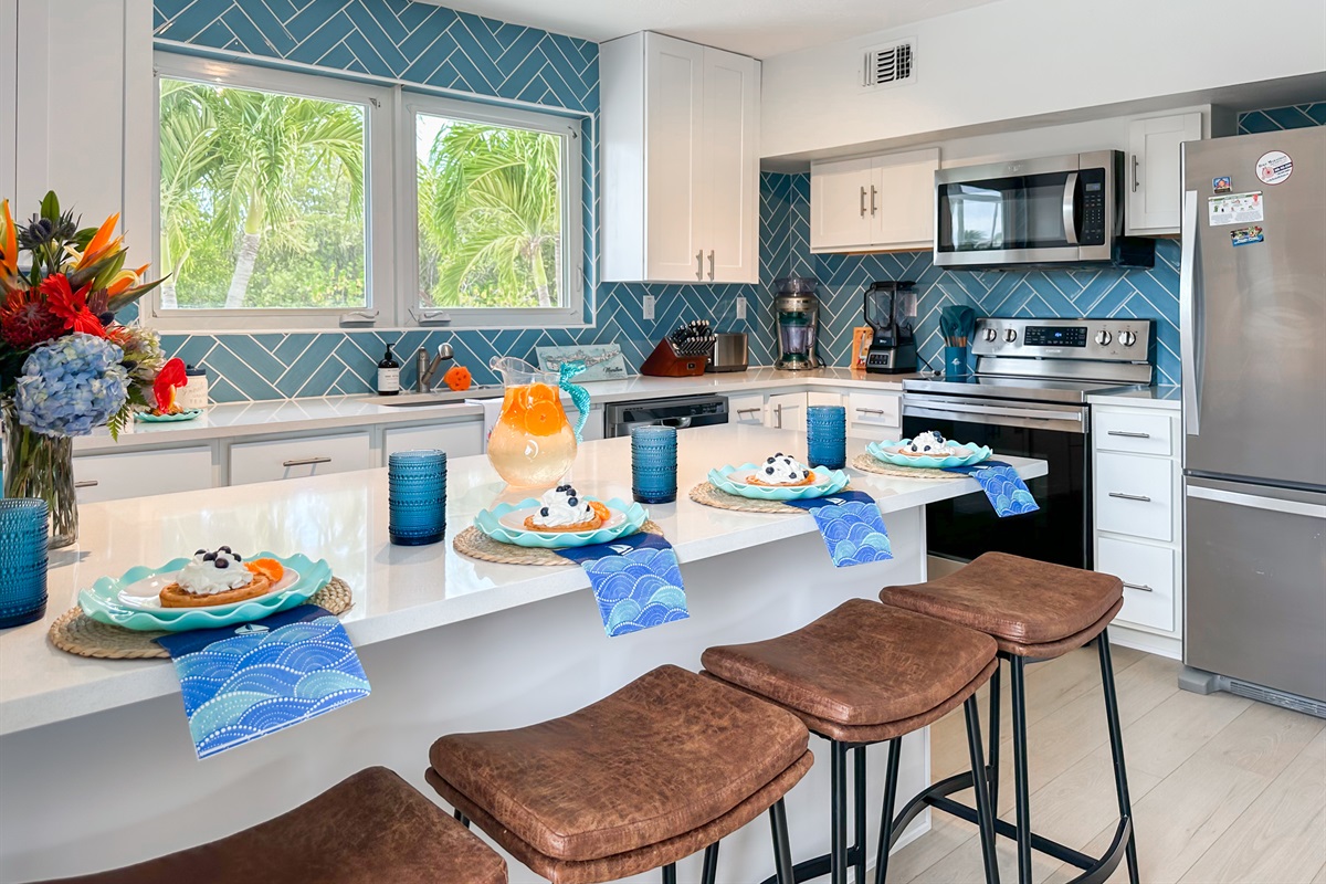 This fully stocked kitchen and stainless steel appliances make cooking easy!