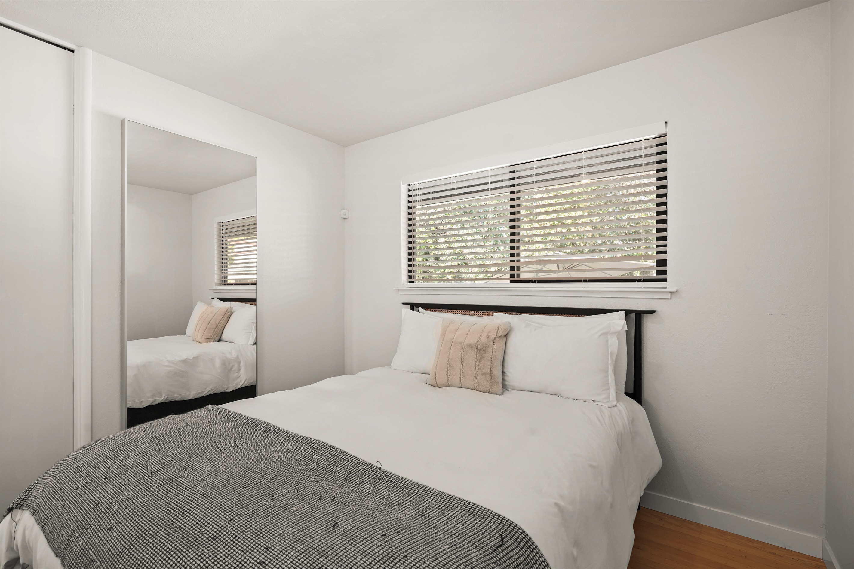 Well-appointed bedroom featuring a queen bed and relaxing ambiance, perfect for couples, friends, or family members.