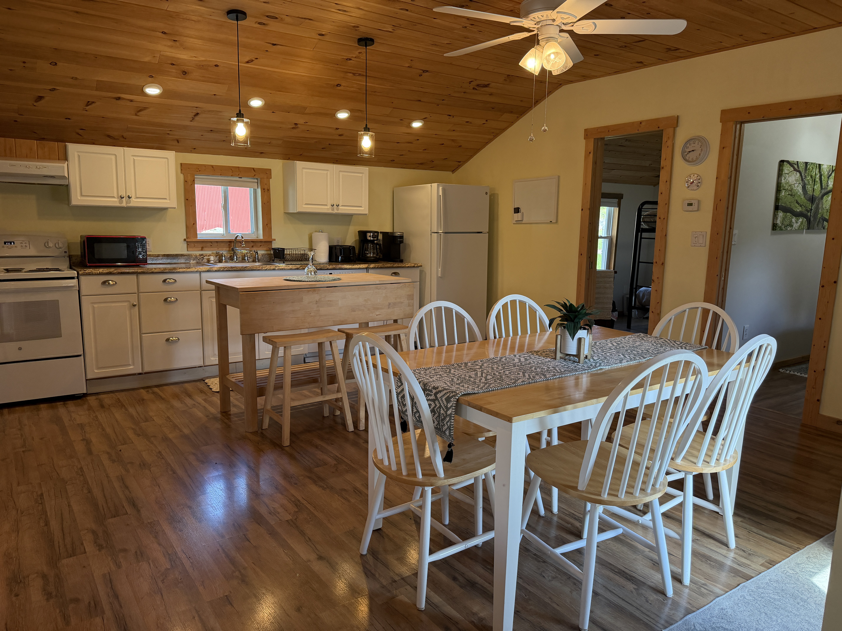 Dining and kitchen with bedrooms on the right