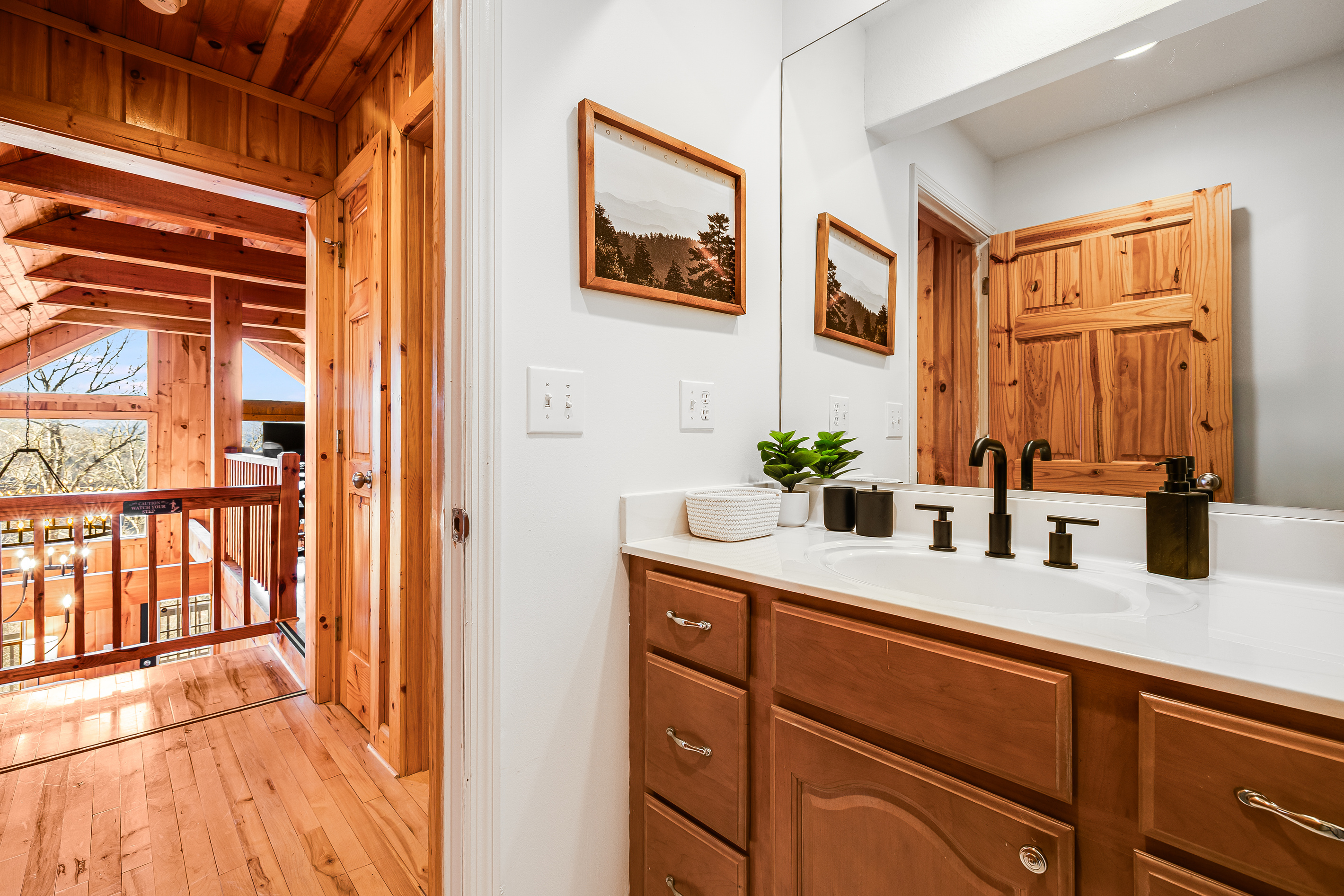 Full bathroom on the upper level between the guest and bunk bedrooms