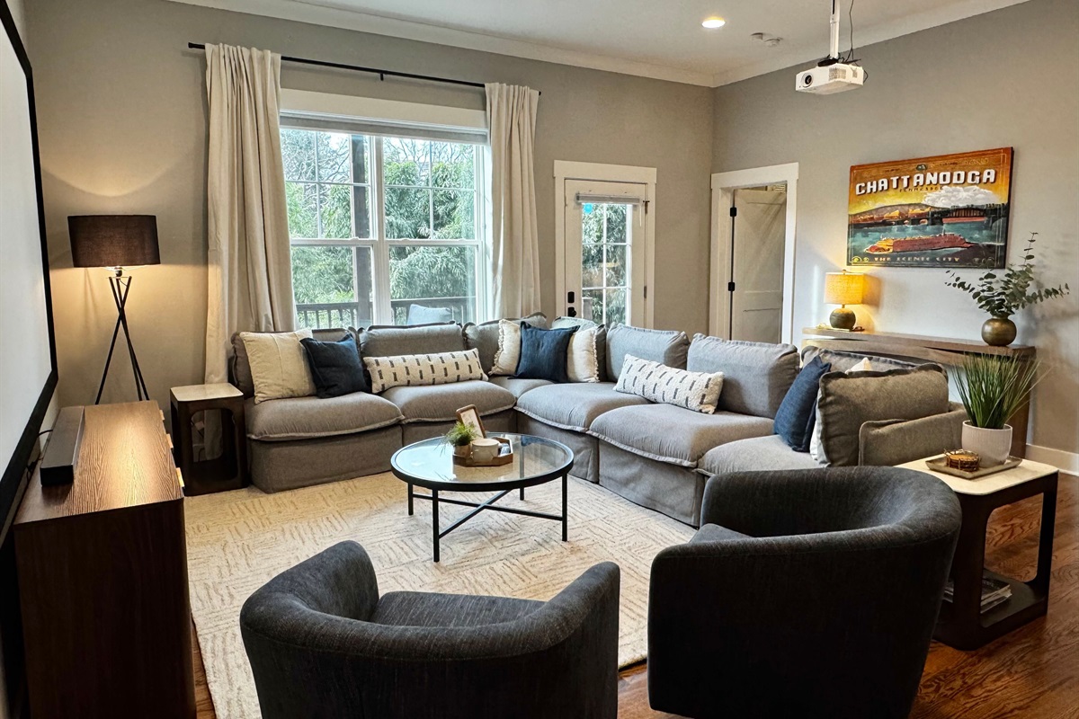 Your perfect spot for a movie night on the massive projector screen or a fun game night!