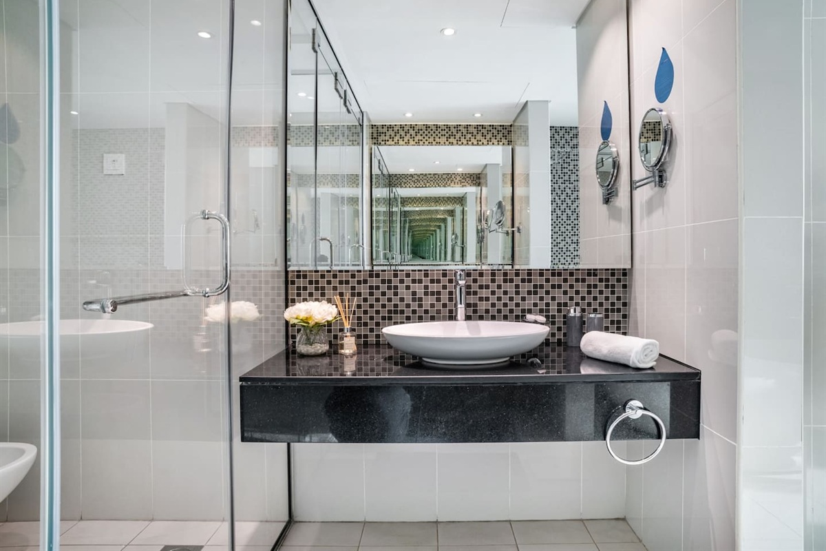 Large bathroom with bath-tube and shower