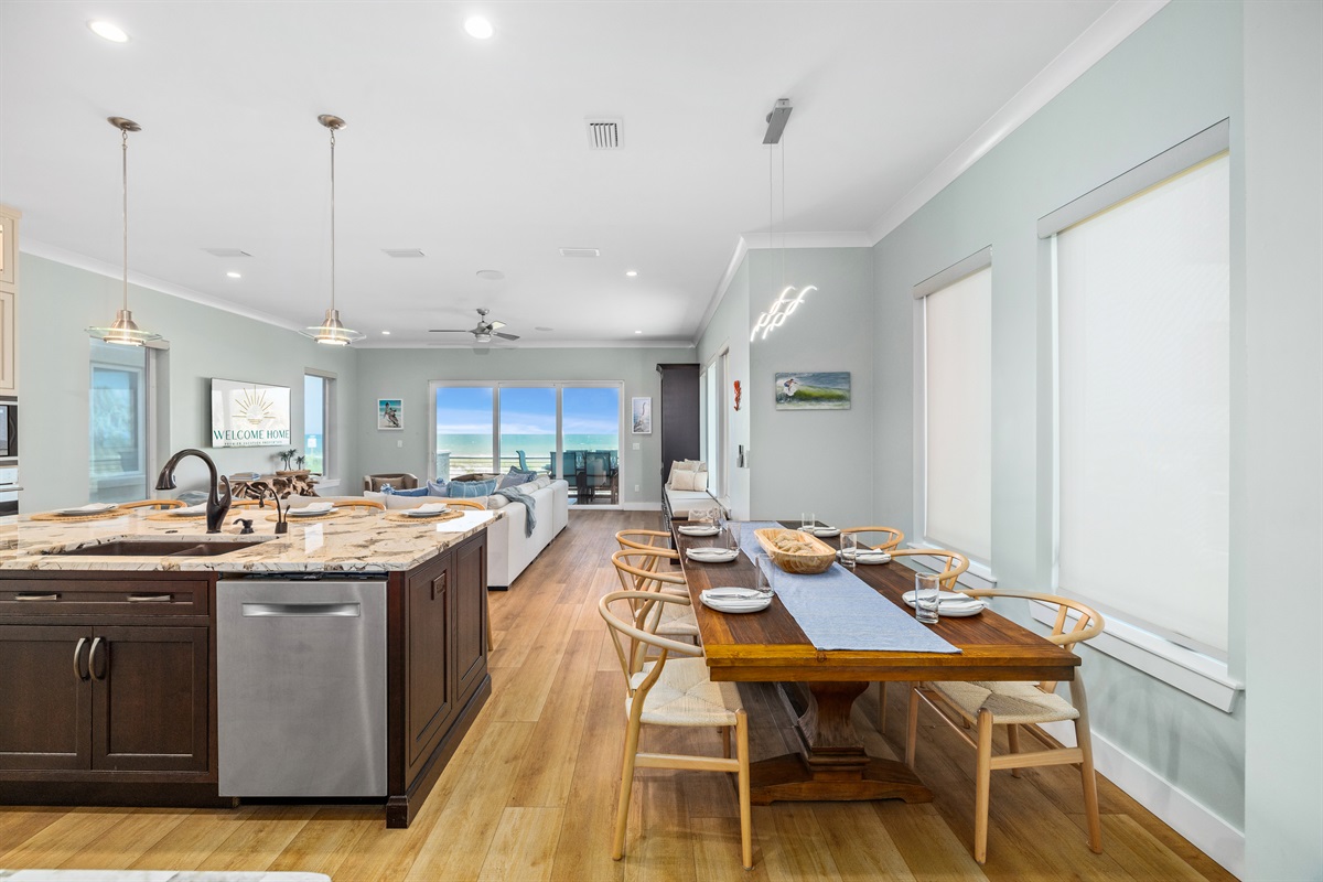 Dining area right off the kitchen with fresh coastal touches and flooded with natural light