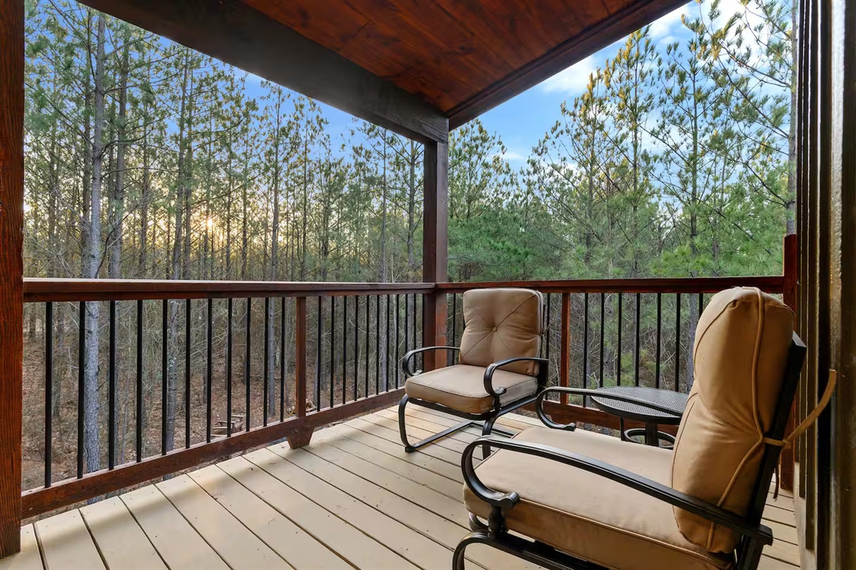 Every angle of this luxury cabin celebrates the outdoors — spacious seating, natural wood details, and peaceful forest views for everyone to enjoy.