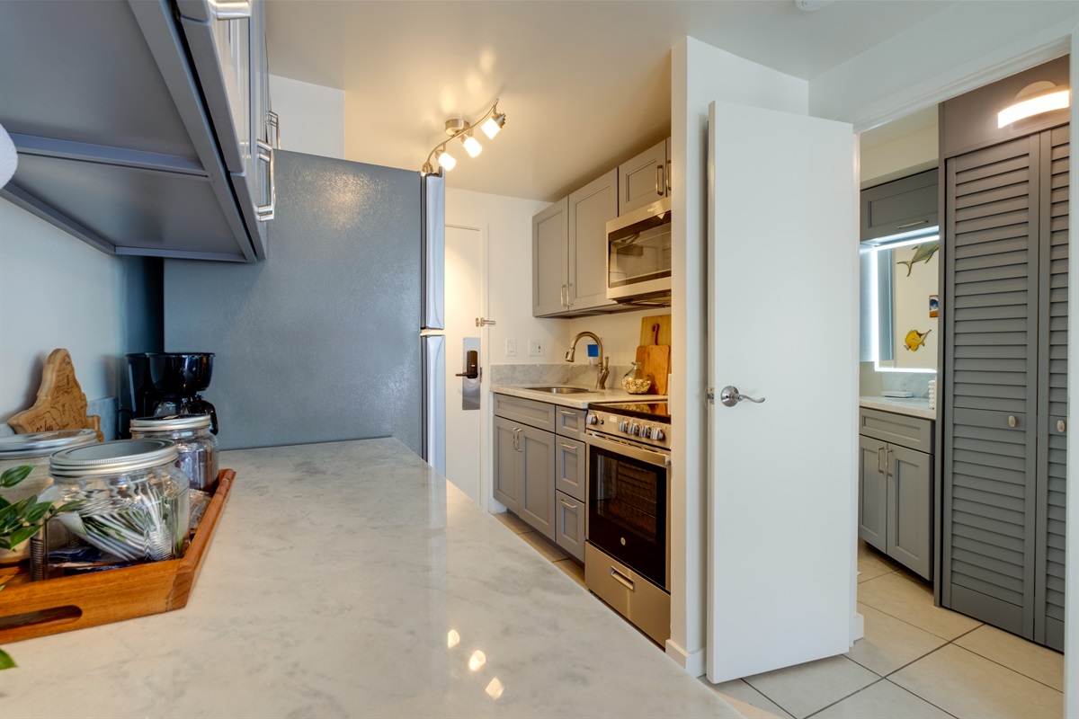 Your island kitchen awaits — bright, modern, and fully stocked for convenience. Whether you’re brewing Kona coffee or preparing a light island meal, this thoughtfully designed space makes every moment in Waikīkī feel like home.