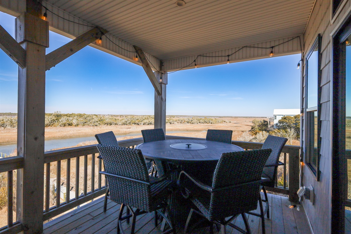 Seating for 6 around the bar height outdoor table