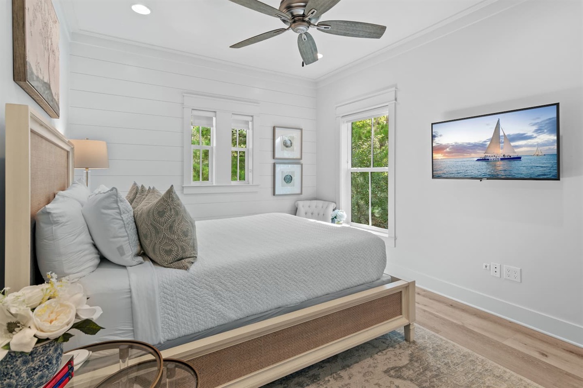 Spacious 2nd level queen bedroom suite with full ensuite bathroom, tiled shower, and a large vanity.