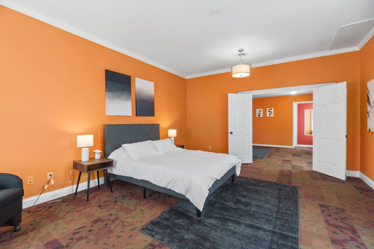 View of the bedroom showcasing its spacious layout, offering plenty of room for relaxation and comfort.