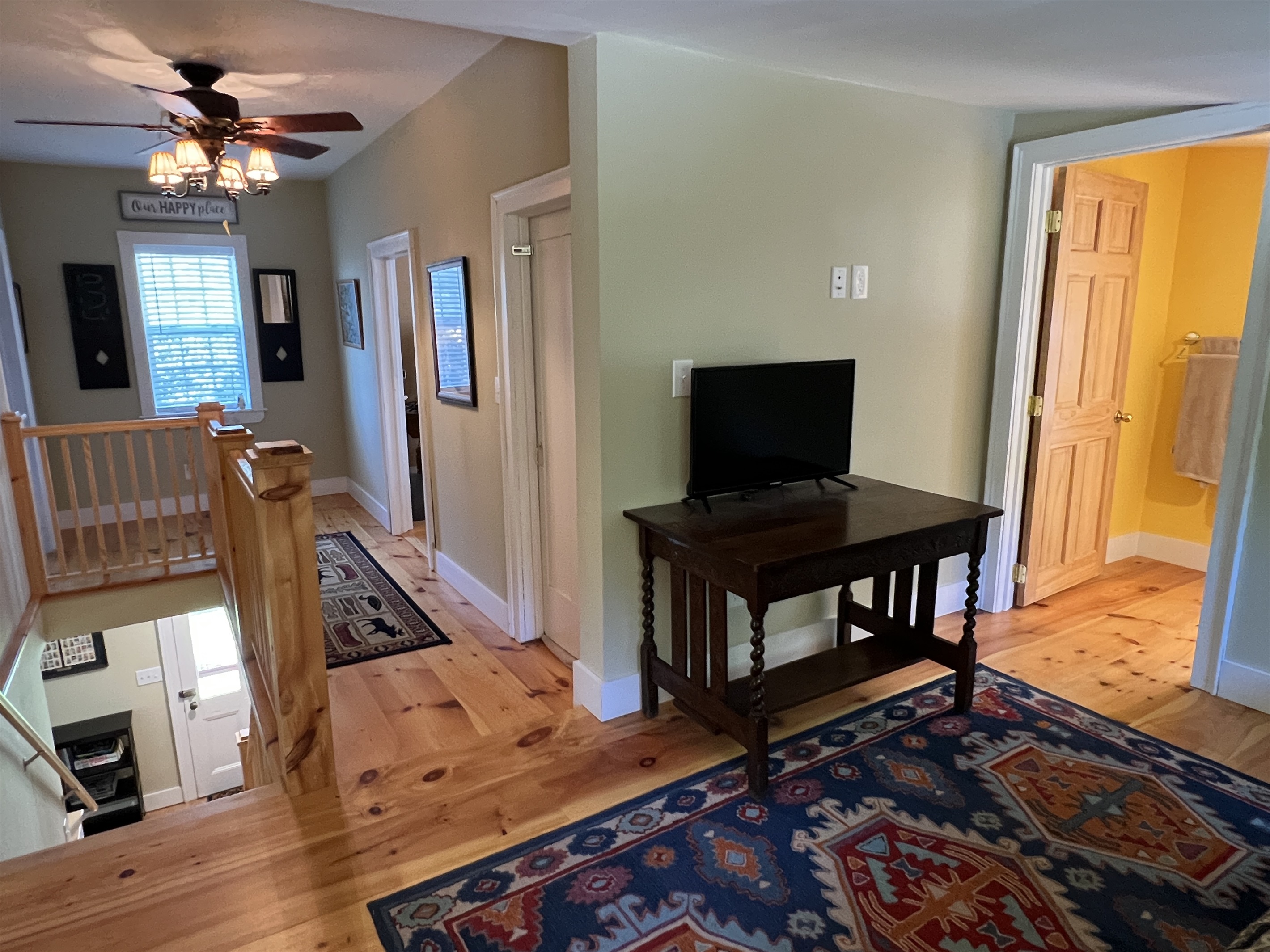View of the stairs and hallway to the bedrooms. The bathroom is the the right.