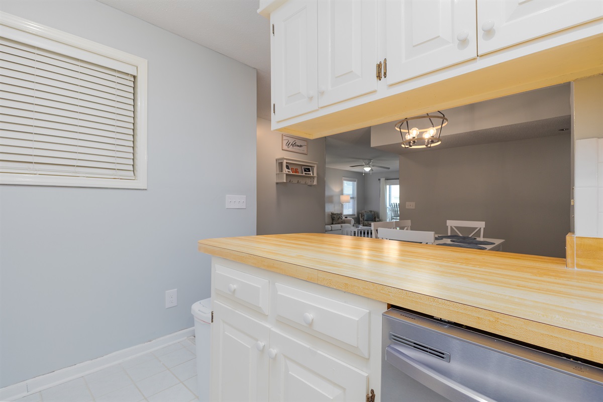 Views of living room and dining table from the kitchen