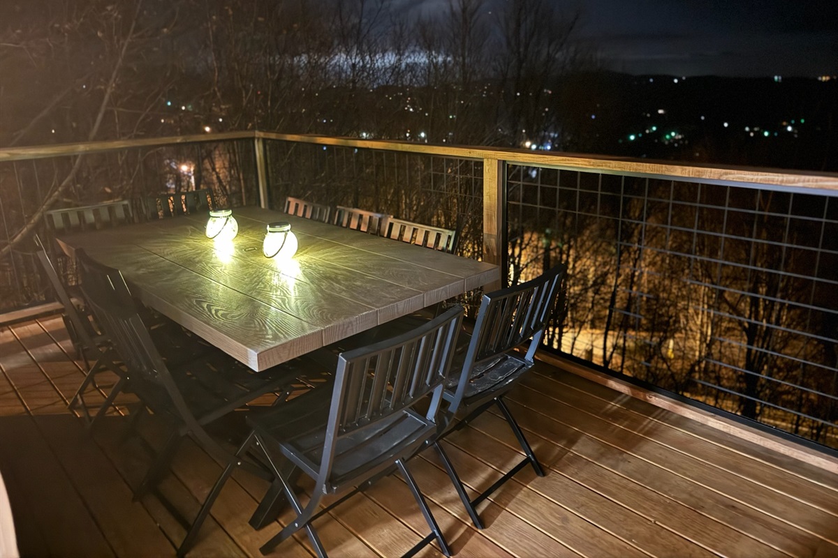 Right outside the indoor dining area is an outdoor dining area seating up to 10. Enjoy this table & chairs for dining or games with amazing views!