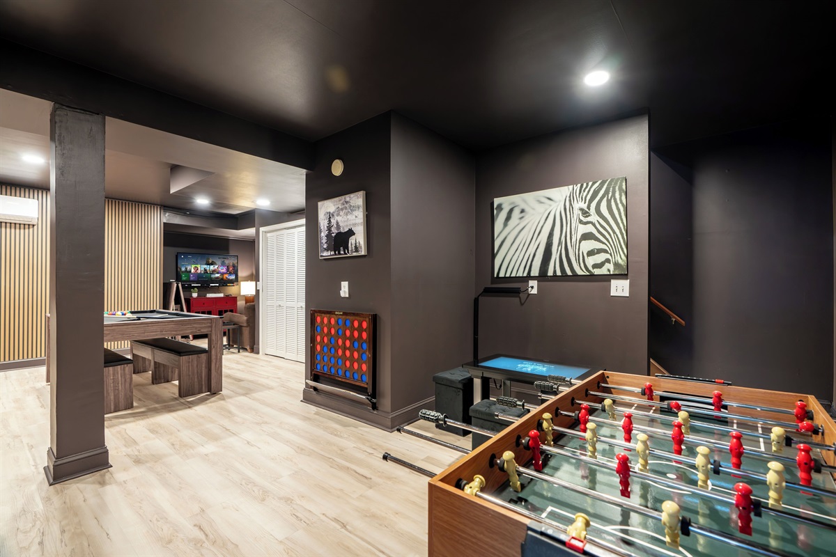 Game room with pool, foosball, video games, and more