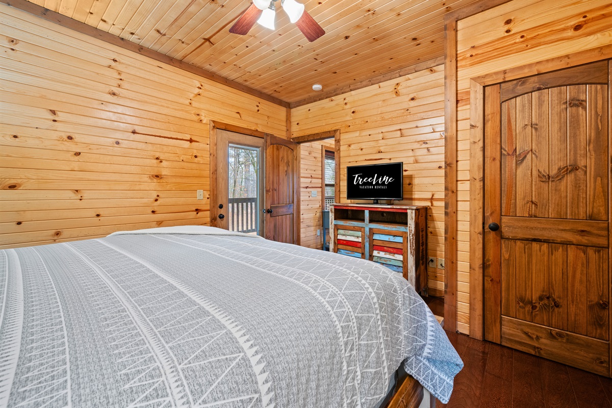 Another angle of the primary bedroom highlights the thoughtful details and warm wood tones that make the space feel calm and inviting.