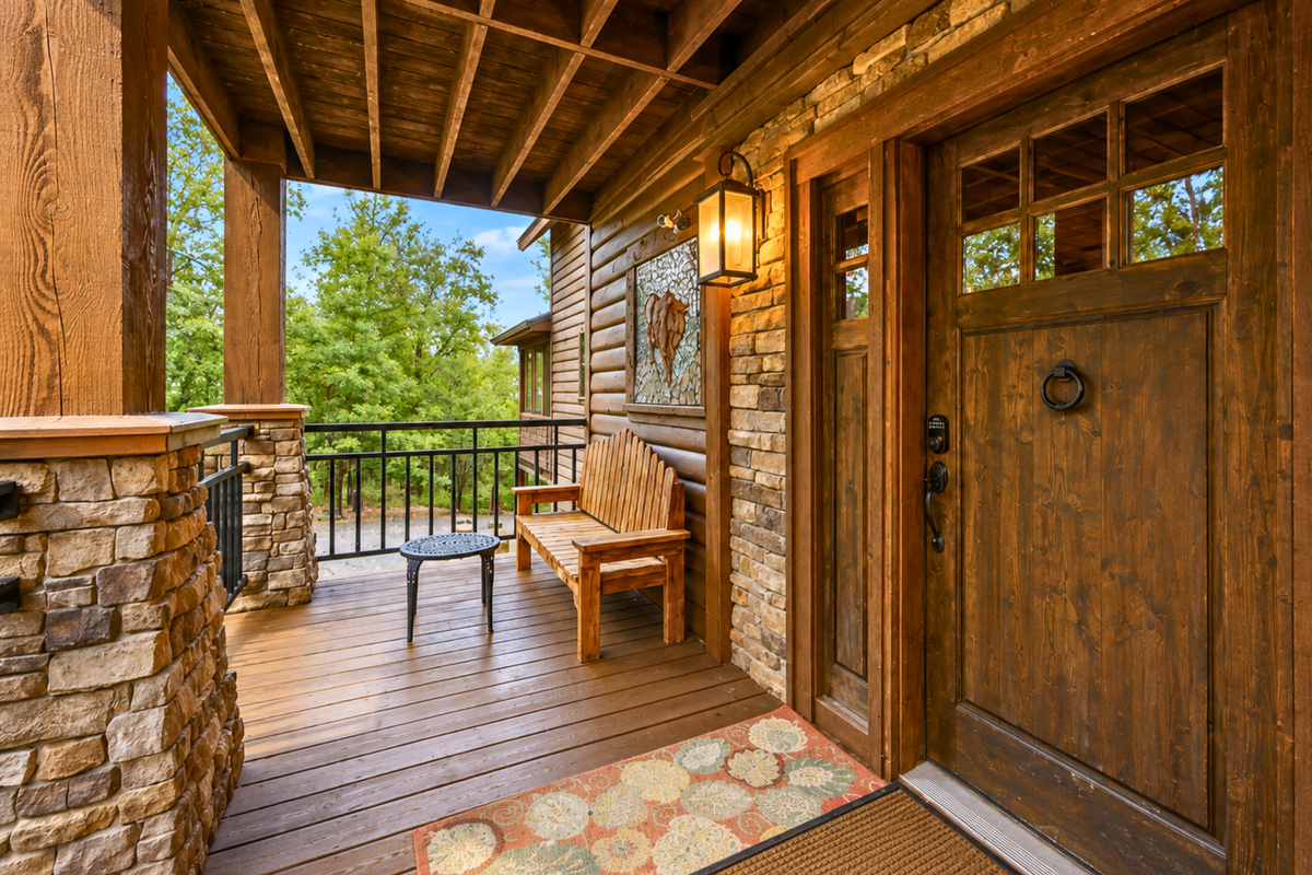 From the moment you arrive, the covered entry and warm wood details set the tone for a comfortable cabin stay surrounded by nature.