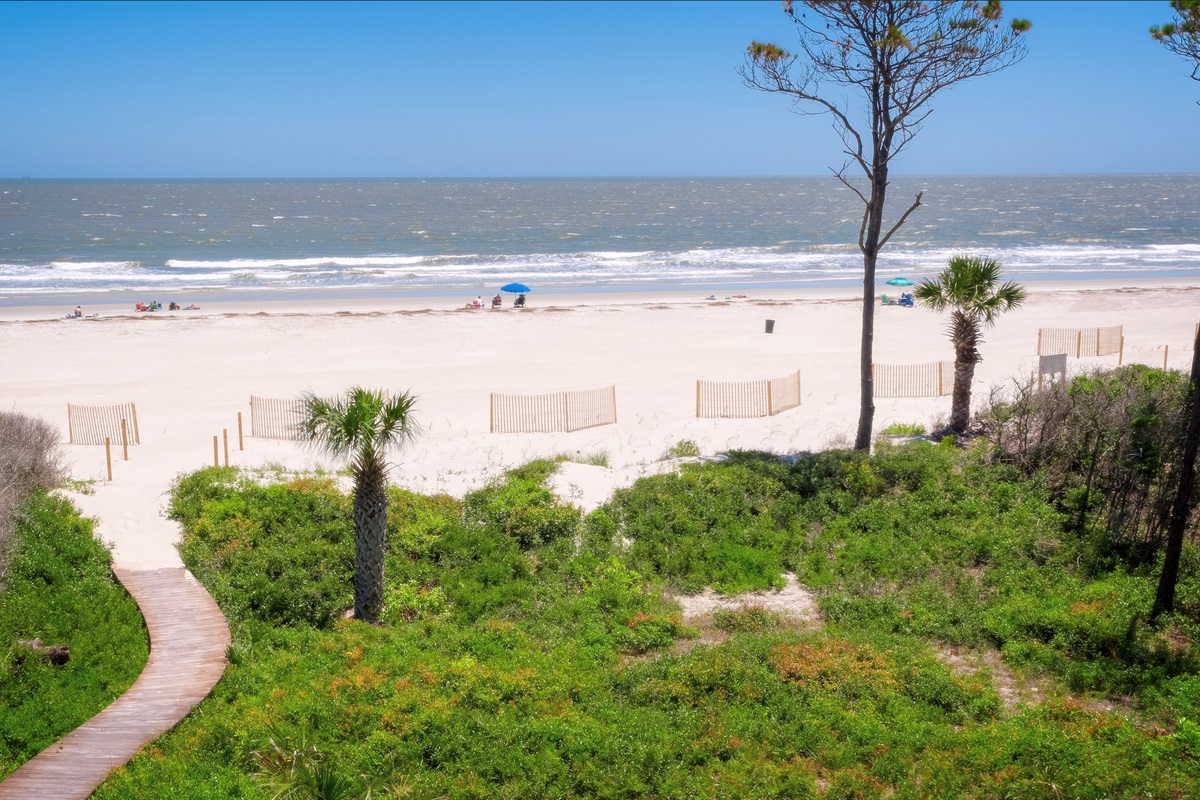 View of beach in front of house