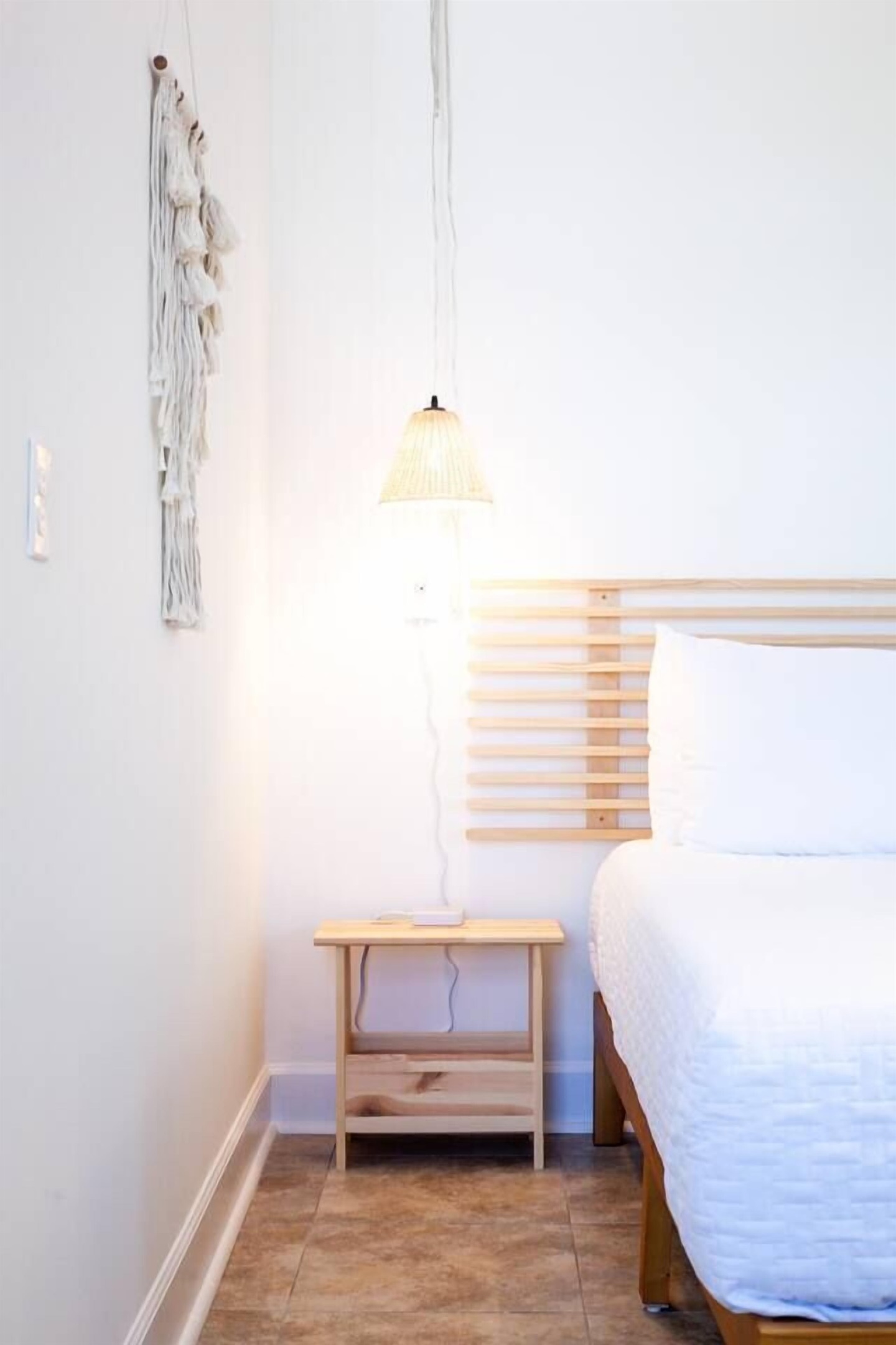 Both bedside tables include a charging station for your convenience