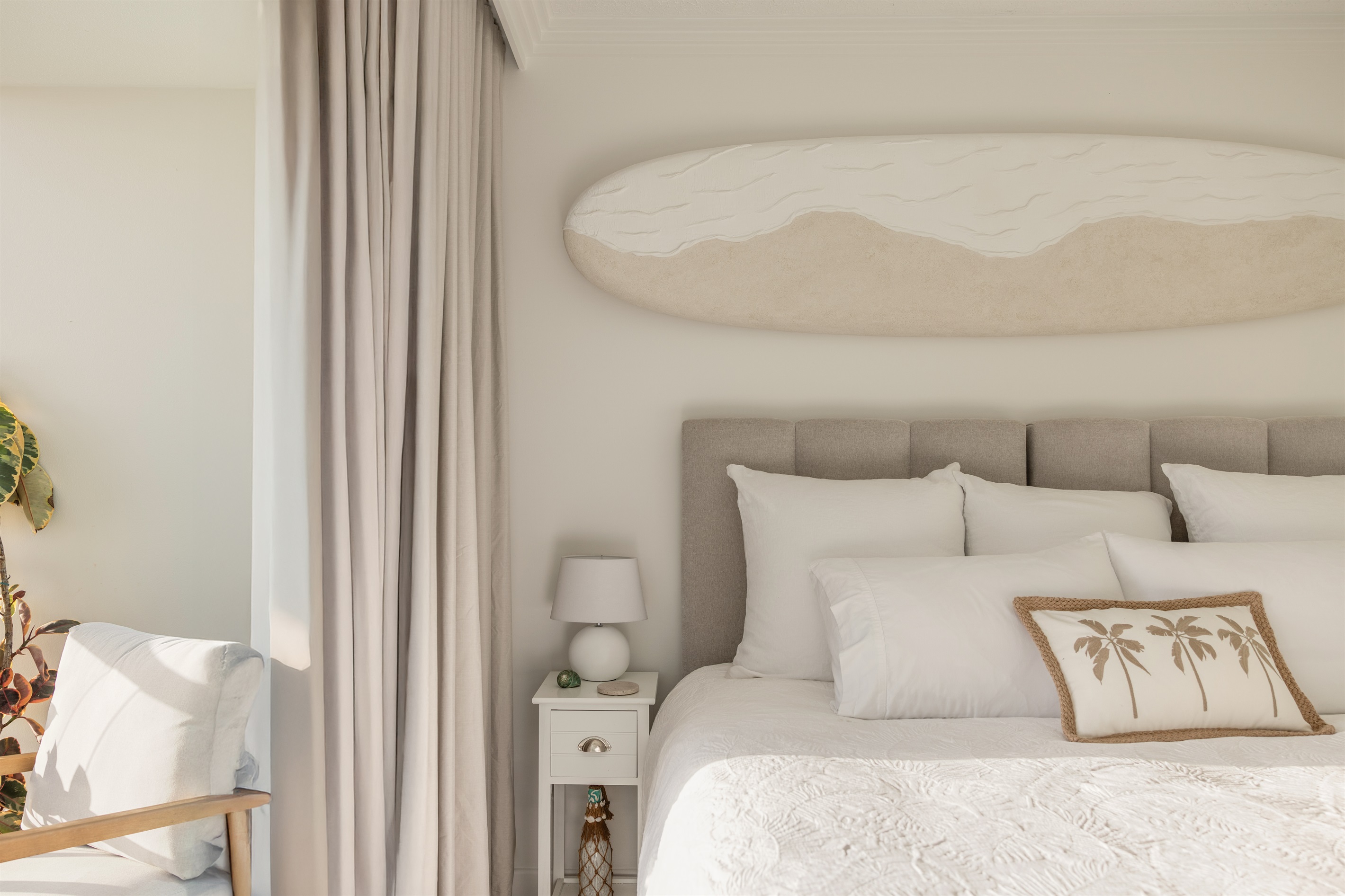 King bed in beachfront Studio - premium linens, blackout curtains & tranquil coastal styling.