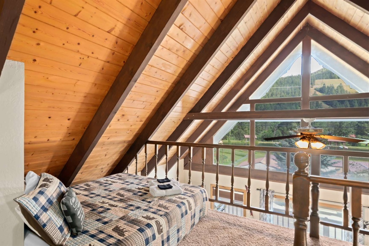 Wake up to views of the treetops from the loft’s private balcony.