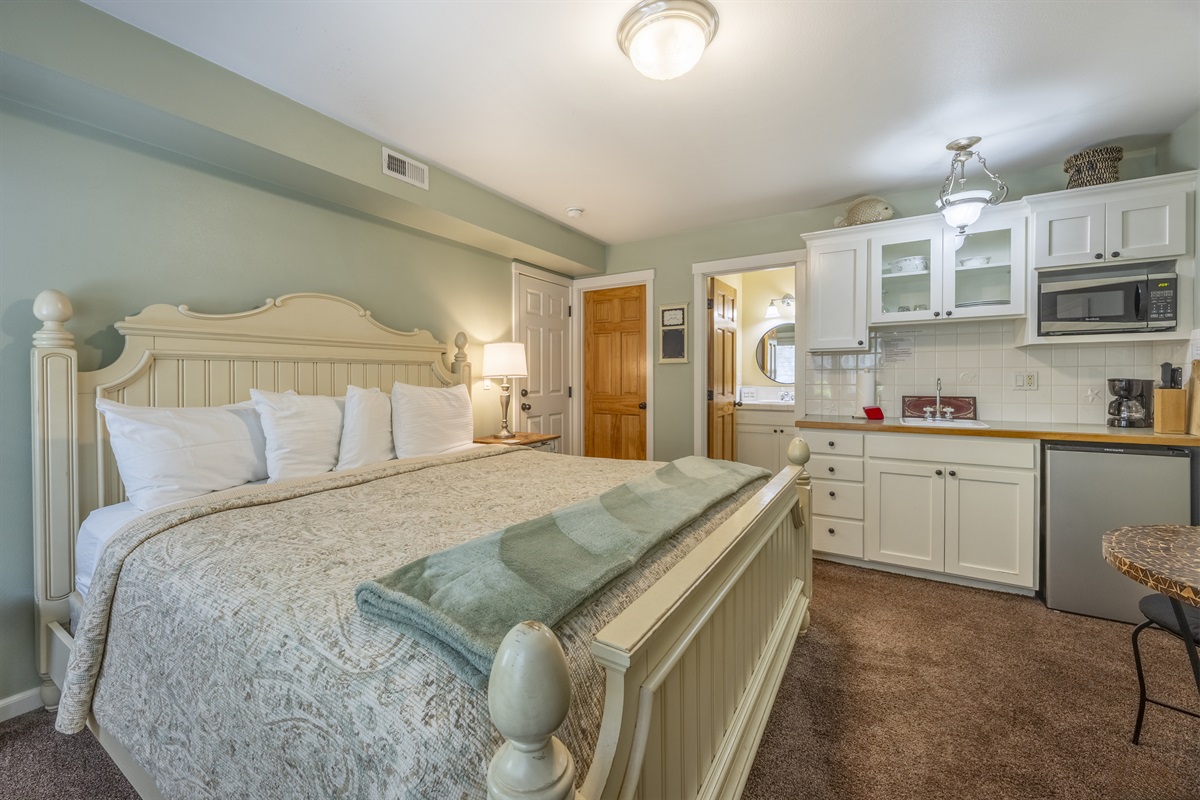 Paris Suite ~ The second master in the home, featuring its own private entrance, cozy fireplace, kitchenette, and Smart TV.