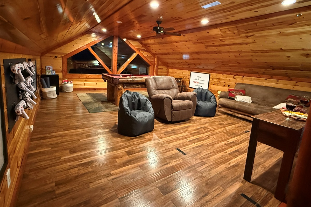 Our spacious entertainment loft designed for all ages—loaded with games, laser tag, cozy seating, and plenty of room to relax or compete.
