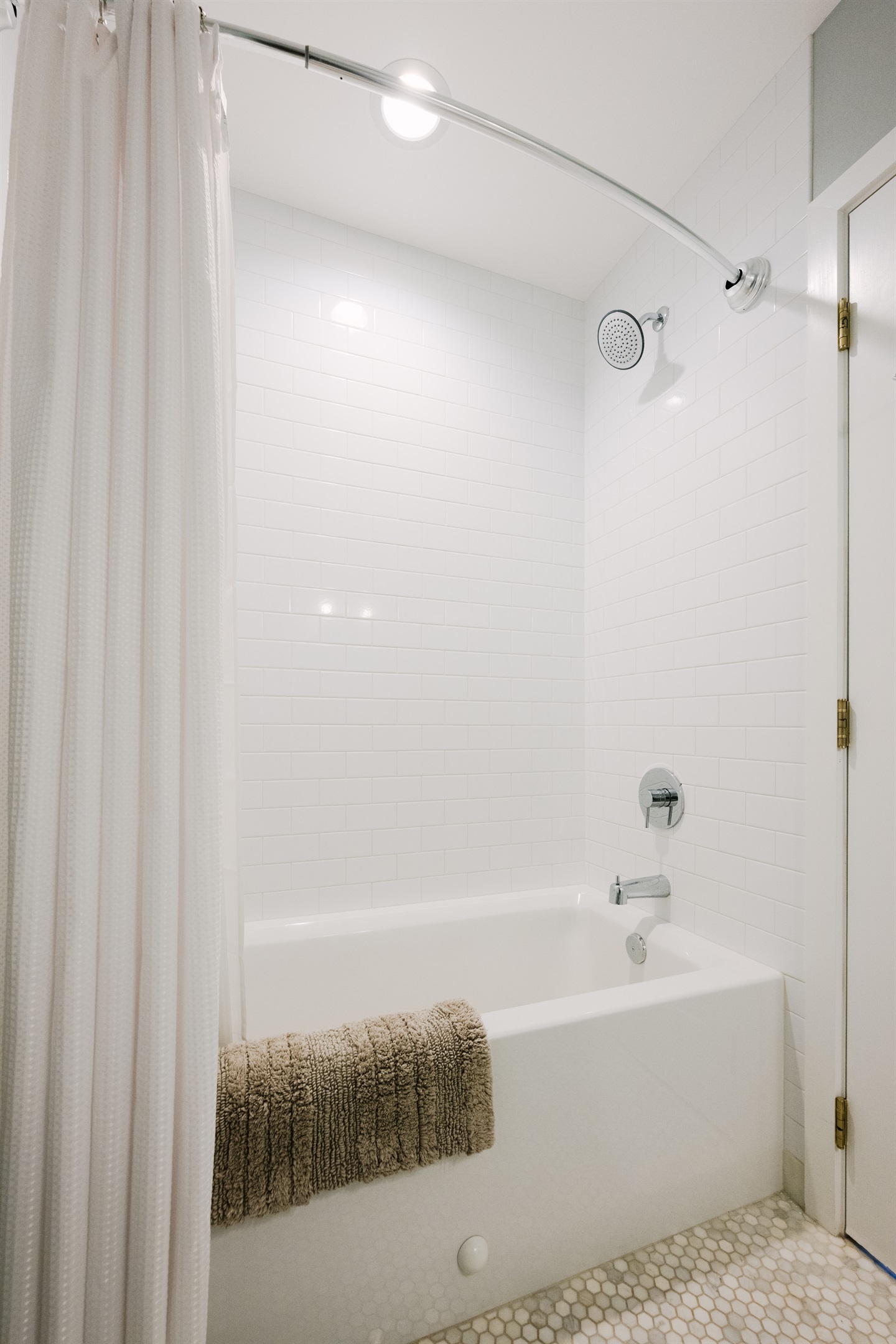 Shared full bathroom in Cookhouse: tub/shower combo.