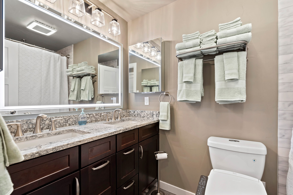 Enjoy the spacious main bathroom with a luxurious garden tub, double vanity, and bidet, designed for comfort and convenience.
