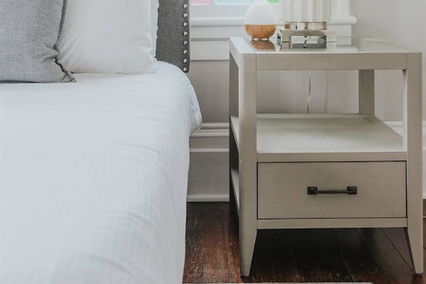 Primary bedroom with ensuite bath is truly a gem.  Stretch out on the king sized bed, enjoying the Savannah sunshine shining through the stain glass windows.  Located on one of the quieter blocks, you'll sleep until your heart's content.