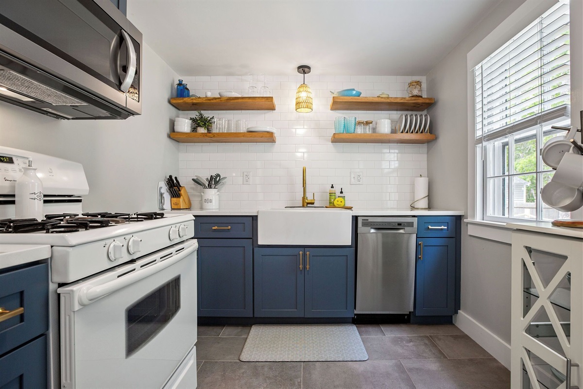 Chic and coastal, this fully renovated and stocked kitchen has all the luxuries of home!