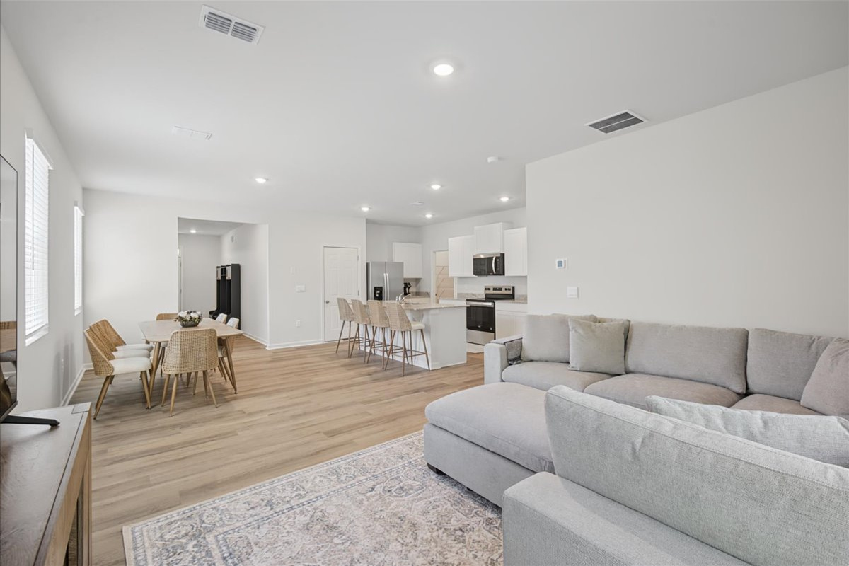 Open-concept main level where living, dining, and kitchen all flow together